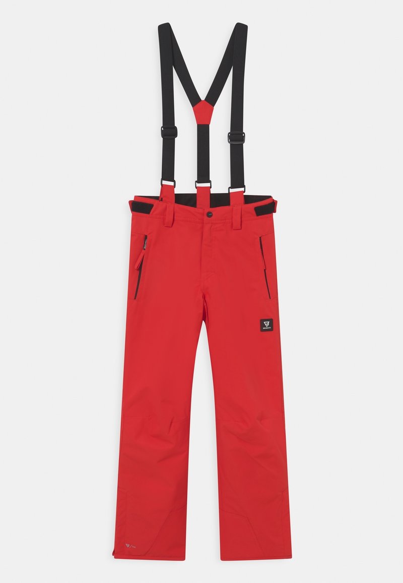 Pantalon de ski imperméable rouge avec bretelles noires réglables, poches latérales zippées et sangles velcro à la taille, présenté sur un fond uni.