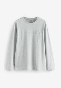 Lichtgrijze lange mouwen t-shirt gemaakt van zachte stof. Heeft een ronde hals en een klein borstzakje aan de linkerkant.
