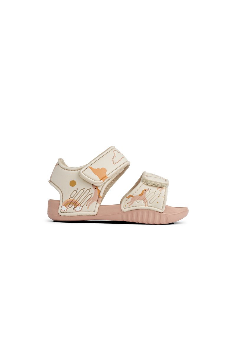 Light beige sandals with pink soles. Adjustable straps feature a pattern of clouds and abstract shapes in peach and gold tones.