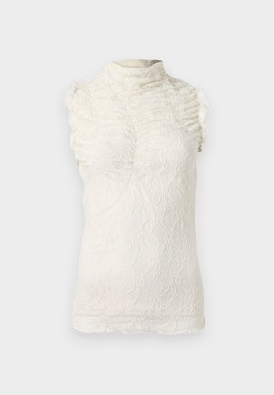 Top sin mangas de encaje en color crema con cuello alto, que presenta detalles con volantes y un intrincado patrón texturizado en todo su diseño.