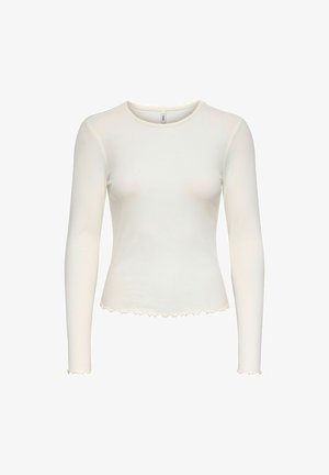 Weißes Langarm-Rippoberteil mit Rundhalsausschnitt und welligem Saum. Weiche Textur und taillierte Silhouette, mit Rüschensaum an den Ärmelenden und am Saum.