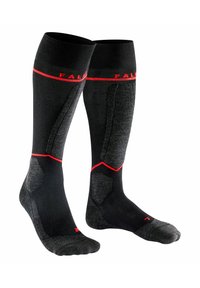 Calcetines negros hasta la rodilla con acentos rojos y áreas reforzadas. Presentan un patrón texturizado para mejorar el agarre y el soporte.