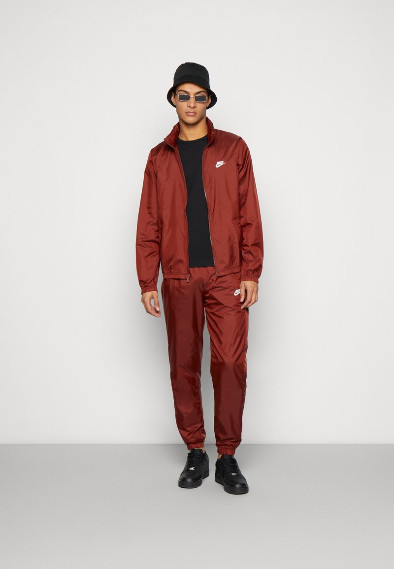 brown and white nike tracksuit