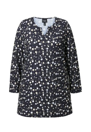 Pitkähihaisessa tummansinisessä tunikassa on ympyräkuvioita hajautetusti valkoisena ja kermanvärisenä. Siinä on V-mallinen kaula-aukko ja rento istuvuus.