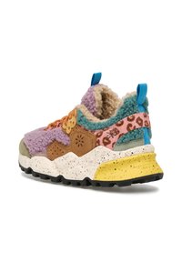 Multicolored sneaker with a textured upper in purple, brown, and teal, featuring speckled soles and animal print accents. Yellow heel cap.