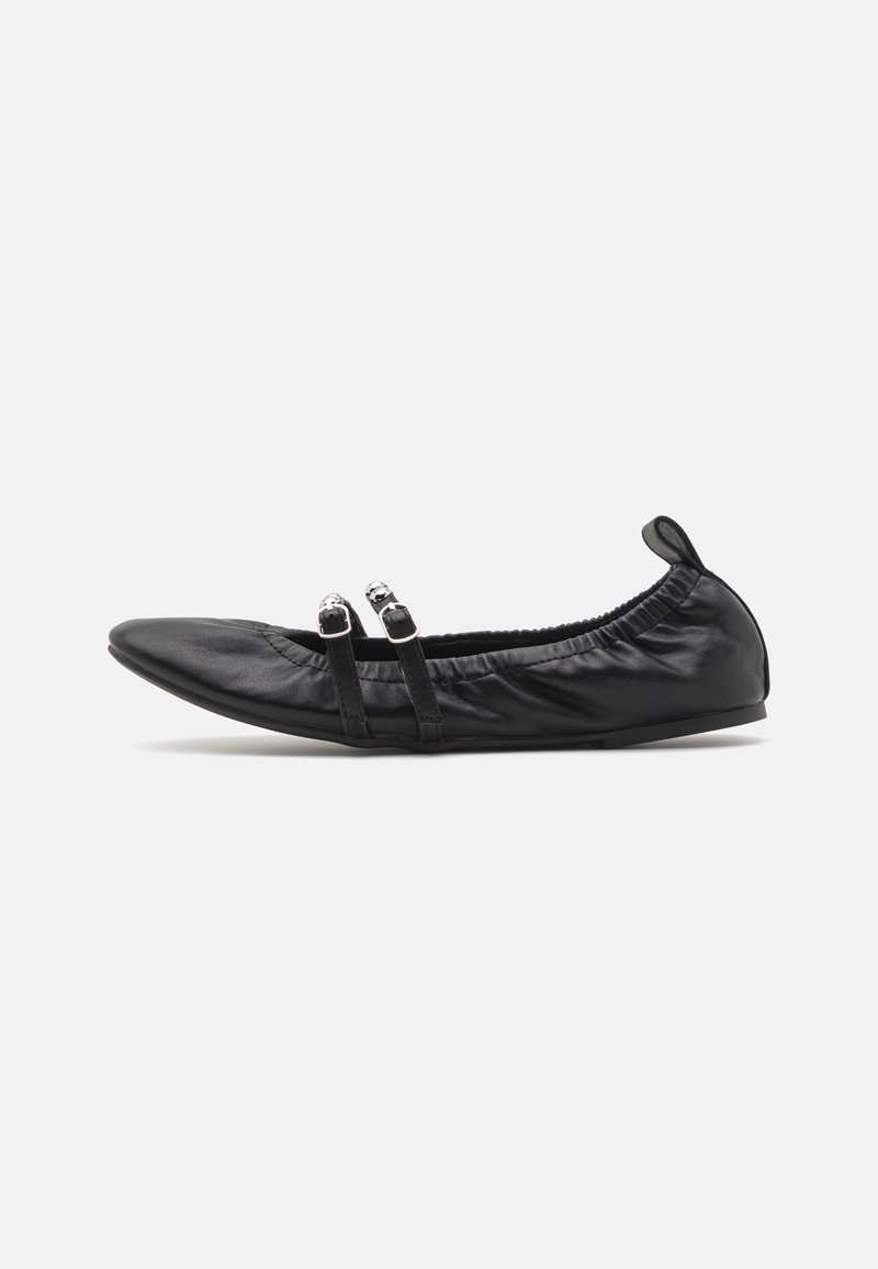 Black ballet flat made of smooth leather, featuring a pointed toe, gathered trim, and two decorative straps with circular accents.