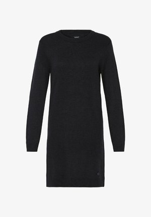 Černé pletené šaty ve tvaru svetrů s dlouhými rukávy, kulatým výstřihem a mírně volným střihem. Obsahují decentní logo detail na lemu. Jemná textura.