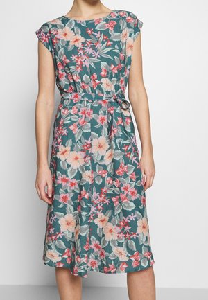 Floral dress in teal with short sleeves. Features a belted waist, midi length, and a vibrant pattern of pink, red, and white flowers.