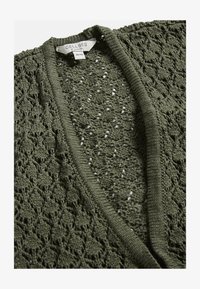 Niewybrane, khaki green