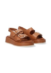 Helle Leder-Sandalen mit zwei verstellbaren Schnallen, offenem Zehenbereich, Ausschnitten an den Seiten und einem dicken Plateausole in einer helleren Farbe.