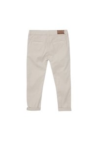 Beiga bomullbyxor med rullad fåll och två bakfickor. Har en läderlogotyp på midjebandet.