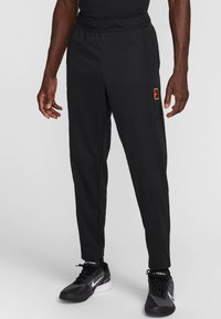 NIKECOURT HERITAGE SUIT PANT - Treningo apatinė dalis - black black