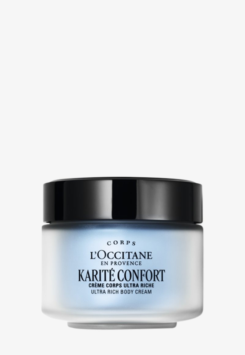 Krem do ciała L'Occitane Karité Confort o ultra-wzbogaconej konsystencji, w niebieskim mlecznym szklanym słoiku z czarną pokrywką, z eleganckim czarnym napisem na etykiecie.
