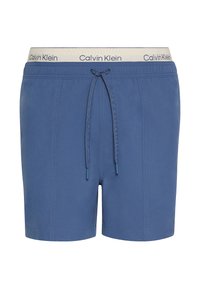 Costumini da bagno blu con vita regolabile, caratterizzati da una cintura con logo beige di Calvin Klein e tessuto liscio con dettagli di cucitura discreti.