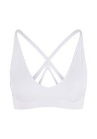 Witte bralette met een V-halsontwerp en gekruiste banden op de rug. Gemaakt van zacht materiaal met een brede onderband en zonder zichtbare hardware.