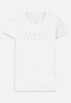 White cotton t-shirt with a round neck, short sleeves, and "ARMANI EXCHANGE" in silver studs across the chest. Simple design, no patterns.