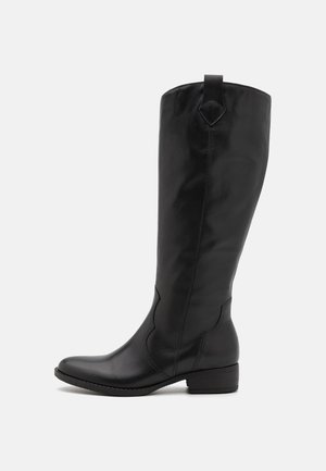 Botte noire en cuir, montant jusqu'au genou, avec un bout arrondi, un petit talon bloc et des coutures décoratives. Dispose d'une languette à l'arrière pour un enfilage facile.