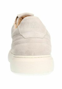 Light grey suede sneakers with a padded back, featuring ridged design details and a white rubber sole. Embossed logo on the heel.