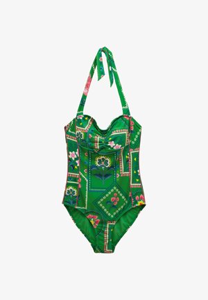 Vihreä yhden palan uimapuku, jossa on vaaleanpunaisia ja sinisiä kukkakuviollisia päällysteitä sekä solmittava kaulushihna.