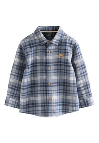 Kék kockás flanel ing fehér és tengerészkék vonalakkal. Gallérral, gombos elejjel és egy kis barna medve logóval a mellrészen.