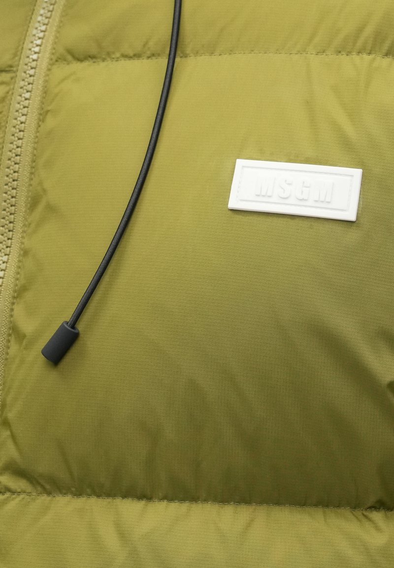 Olive green puffer jacket section featuring a white MSGM logo patch, black drawstring, smooth texture, and quilted stitching detail.