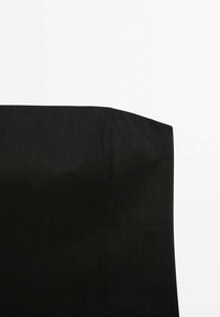 Black fabric cover with a smooth texture, shaped to fit a chair or cushion, featuring clean, minimal lines and rounded edges.