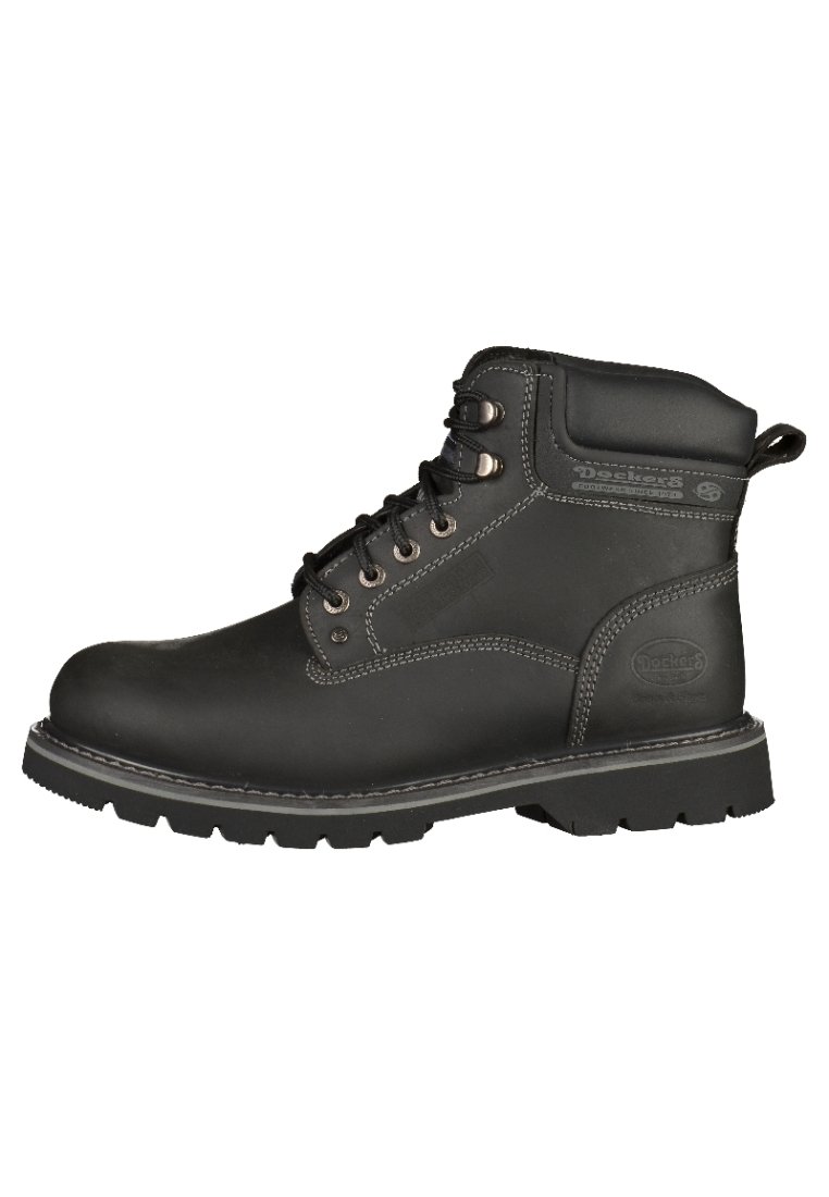 Botas de trabajo de cuero negro con un collarín acolchado, ojales de metal y costuras en contraste. Presenta una suela de goma texturizada para mayor agarre.