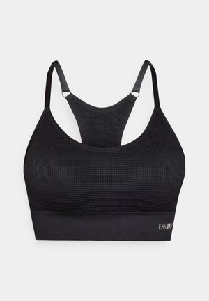 Black sports bra with a textured fabric, featuring adjustable straps, a racerback design, and a logo accent at the bottom band.