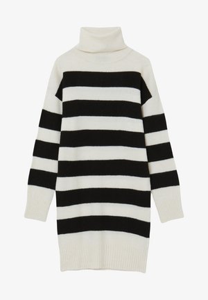 Pull en col roulé à rayures noires et blanches, avec une coupe ample, des manches longues, des poignets côtelés et une texture douce.