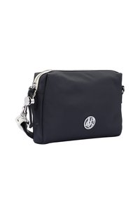 Black nylon crossbody bag with silver hardware, zip closure, side pull tab, and logo detail on front. Compact rectangular shape.