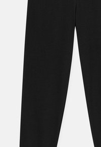 Black cotton trousers with a straight-leg design. Smooth texture, elastic waistband, no visible pockets or embellishments.