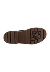 Rubber shoe sole in brown with textured patterns and grooves for grip. Features a logo and is designed for durability and traction.