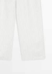 White pinstriped pants with a straight leg design, featuring a smooth texture and subtle gray stripes. No visible pockets or embellishments.