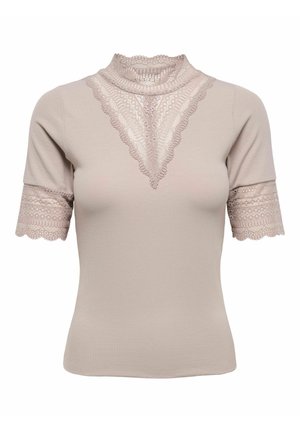 Haut à manches courtes beige clair en tissu côtelé, avec bordure en dentelle autour du col montant, en forme de V sur la poitrine, et aux poignets des manches.
