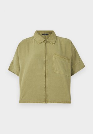 Chemise kaki à manches courtes avec fermeture éclair sur le devant, col pointu et poche poitrine unique. Fabriquée en coton avec une finition texturée.