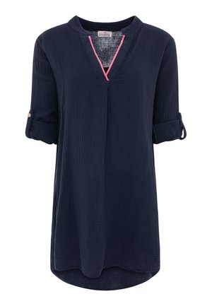 Marineblaue Langarm-Tunika mit hochgekrempelten Ärmeln, V-Ausschnitt mit rosa Besatz und einer lockeren Passform, die über die Hüften reicht.