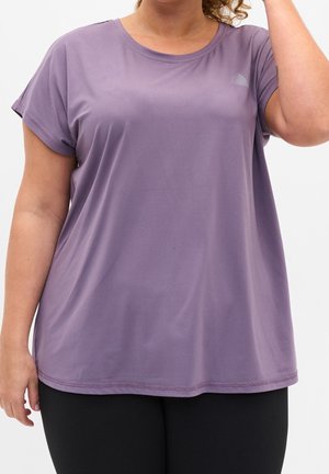 Kurzärmliges, locker sitzendes lila T-Shirt aus weichem Stoff. Verfügt über einen Rundhalsausschnitt und ein minimalistisches Logo-Detail auf der Brust.