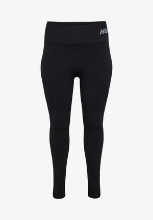 Black leggings made from stretchy fabric. High waistband with HUGO branding in reflective gray. Fitted design with a smooth texture.