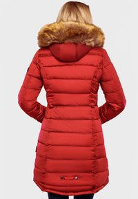 Red puffer coat with horizontal quilted design, fur-lined hood, and black hardware accents. Mid-length with a curved hem and logo detail.