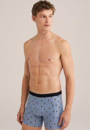 Mænds boxer shorts i lyseblå bomuld. Har et bi-mønster og en sort elastisk talje. Designet med en tætsiddende pasform, ideelt for komfort.