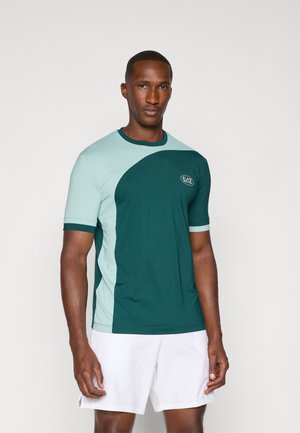 Short-sleeve athletic shirt featuring a teal and light blue color block design, textured fabric, and a logo on the chest.