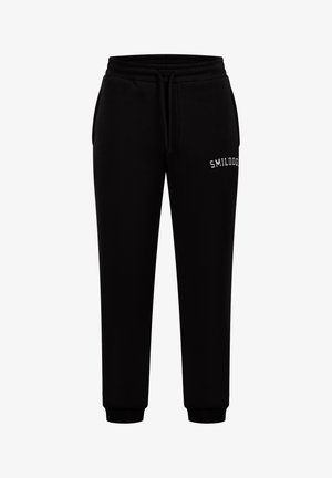 Zwarte joggingsbroek van een katoenmix. Kenmerken zijn een elastische tailleband, trekkoord, zijzakken en geborduurde tekst "SMILODON."