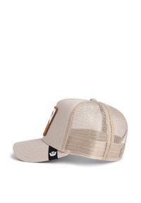 Beige cap with a solid front and mesh back. Features a leather patch and black accent on the left side, curved visor.