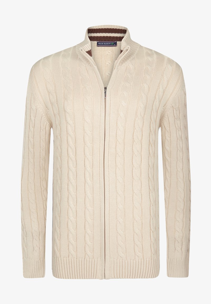 Cardigan a maglia cable color crema con zip completa, colletto alto, polsini e orlo a costine. Presenta sottili accenti a strisce marroni all'interno del colletto.
