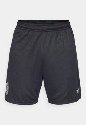 Black athletic shorts featuring vertical ribbed texture, elastic waistband, and embroidered logo on one leg, with a small logo on the hem.
