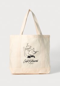 Lerretskjølepose med illustrasjon av en rev som holder en dampende kaffekopp, og teksten "Café Kitsuné Paris" i svart på beige bakgrunn.
