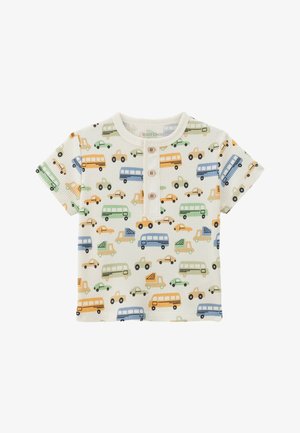 T-shirt crème à manches courtes en tissu côtelé, orné de motifs de véhicules colorés en bleu, orange, vert et noir, avec trois boutons.