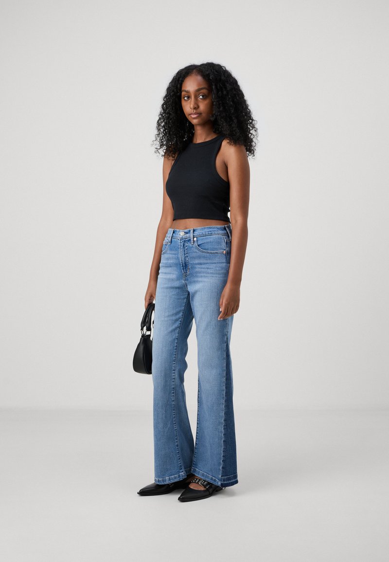 Jeans Zalando Vetement Femme Petite Taille GAP Petite 70S VALE Jean Flare  Medium Indigo/denim Bleu