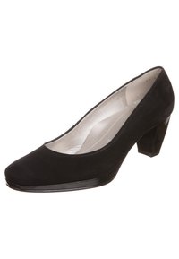 Zwarte nubucklederen pump met een ronde neus, lage blokhak en een gladde binnenvoering. Heeft een glanzend accent op de neus.