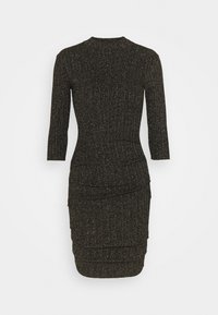 Stickad klänning i svart med metalliska prickar, långa ärmar, hög halsringning och en rynkad design vid midjan och höfterna för en figurnära silhuett.